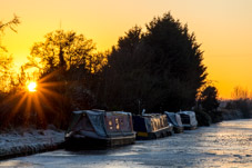 2212-0036 - Narrowboats stuck in the ice at sunset  -  December 15, 2022