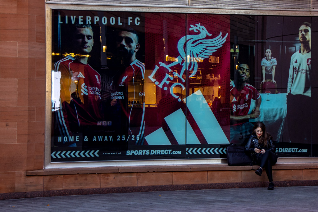 <center>2510-0057 - Sitting in front of Liverpool FC Poster -  October 06, 2025  <br>  (1/30 sec at f / 5.0 ISO 500    65 mm) </center>