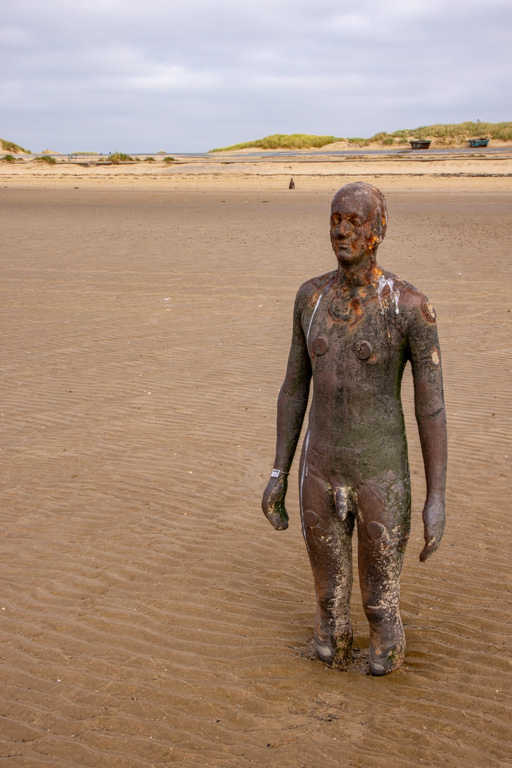 <center>2510-0107 - Another Place by Antony Gormley - Sculpture on Crosby Beach -  October 13, 2025  <br>  (1/60 sec at f / 29 ISO 400    47 mm) </center>